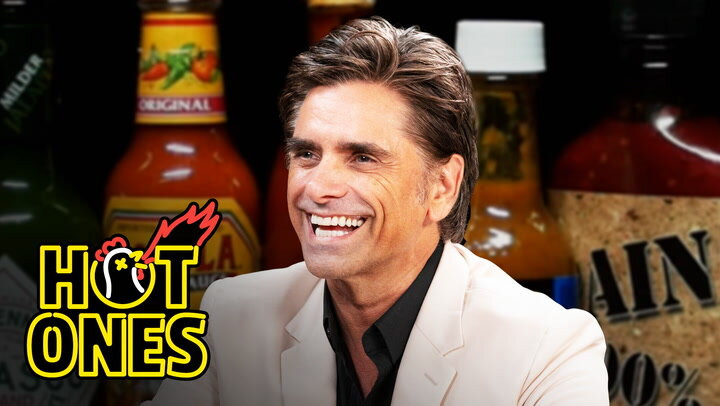 Hot Ones — s21e09 — John Stamos Falls Out of His Chair While Eating Spicy Wings