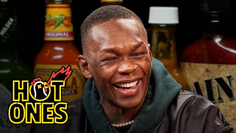 Hot Ones — s19e09 — Israel Adesanya Gives Thanks While Eating Spicy Wings