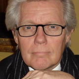 Joel Rogers — VIP Dinner Guest (uncredited)