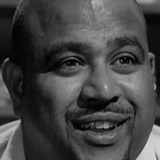 Frank Olegario — Man in Fez (uncredited)