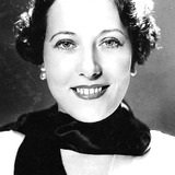 Isabelle Keith — Blonde Party Guest with Bess (uncredited)