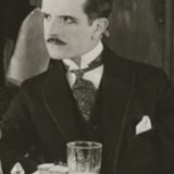 Stanhope Wheatcroft — Distinguished Gentleman in Cafe (uncredited)