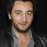 Nader Boussandel — Weapon Seller (uncredited)