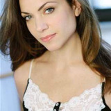 April Martucci — News Reporter (uncredited)