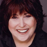 Cynthia Szigeti — Mrs. Capone