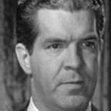 Reid Kilpatrick — Radio Announcer (uncredited)