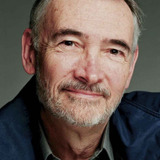 Michael G. Wilson — Man in the Audience at the Pyramid Theatre (uncredited)