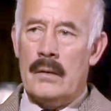 John Abineri — Airline Representative (uncredited)