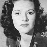 Beverly Lloyd — Wanda, guitarist showgirl