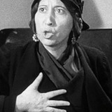 Inez Palange — Woman in Camp (uncredited)