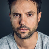 Майкл Аарон Миллиган — Strategy Director