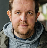 Dominic Burgess — Nigel Elwood