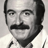Jean Sas — Sports commentator with the moustache