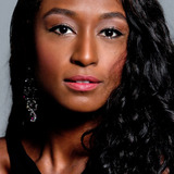 Mila Carmo — Maria (Secretary)