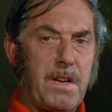 Neil Wilson — Schoolmaster (uncredited)