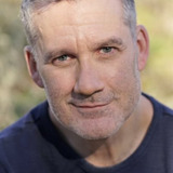 Greg James — Man at the Hotel Bar