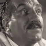 Mario Siletti — Mr. Piscora (uncredited)