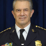 John De Bello — Policeman