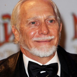 Douglas Gresham — Radio Announcer (voice)