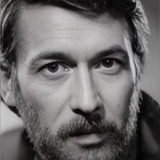 Игорь Суровцев — blond man in a striped shirt