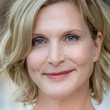 Julie Lancaster — Female Newscaster (uncredited)