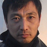 Hiroshi Kasuga — Traveller at Texas Airport (uncredited)