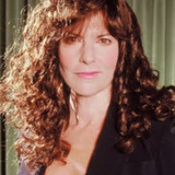 Elaine Corral Kendall — Newscaster (uncredited)