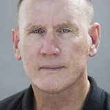 Chris Nelson Norris — Health Club Attendant (uncredited)