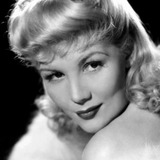 Veda Ann Borg — Miss Friday (uncredited)