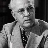 John Hyams — Man With Glasses at Bronson's Surprise Party