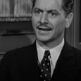 Roger Moore — Chauffeur (uncredited)