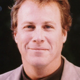 John Heard — Dr. Britain