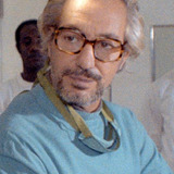 Walter Patriarca — Mr. Philipps, Jane Hopper's guest at TV Station (uncredited)