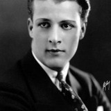 Barry Norton — Benefit Attendee (uncredited)