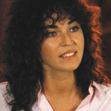 Paola Cozzo — Curly Girl at Meeting (uncredited)