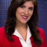 Tammi Arender — Newscaster (uncredited)