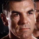 Nick Dimitri — Guerrilla Guarding Plane (uncredited)