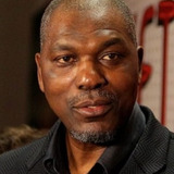 Hakeem Olajuwon — Self - Houston Rockets (archive footage)