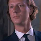 Franco Caracciolo — Young Priest (uncredited)