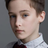 Lochlan White — Newsie Kid - Timmy (uncredited)