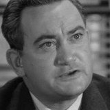 Wendell Holmes — Banker - Critic at City Meeting (uncredited)