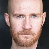 Лоуренс Спэллман — Greg Ellis