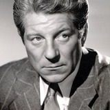 Jean Gabin — Commissioner Jules Maigret