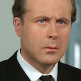 Mark Elwes — Sir Donald's Secretary (uncredited)