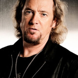 Adrian Smith — Guitar/Backing Vocals