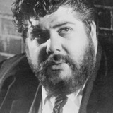 Larry Tucker — Bearded Man Walking in Front of Hotel (uncredited)