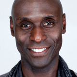 Lance Reddick — Charon