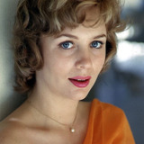 Joan Staley — Blonde in Low-Cut Cream Dress (uncredited)