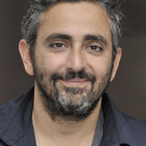 Éric Toledano — The bartender (uncredited)