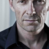 Dennis Kreusler — Car Park Guard (uncredited)